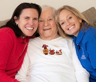 Patient being comforted by nurse and doctor